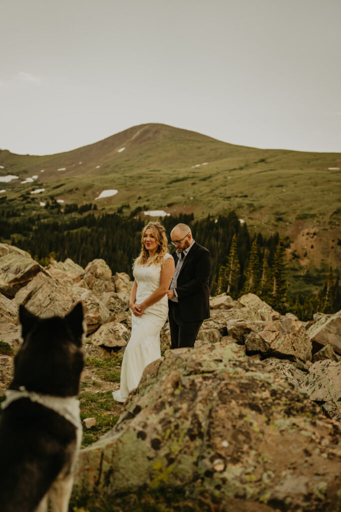 getting ready as a couple at the top of a mountain in colorado
